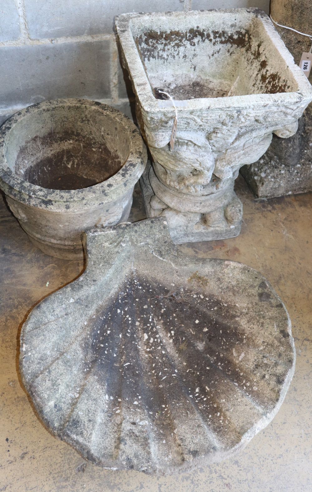 Two reconstituted stone garden planters together with a scalloped shell bird bath, bird bath W.64cm, H.64cm